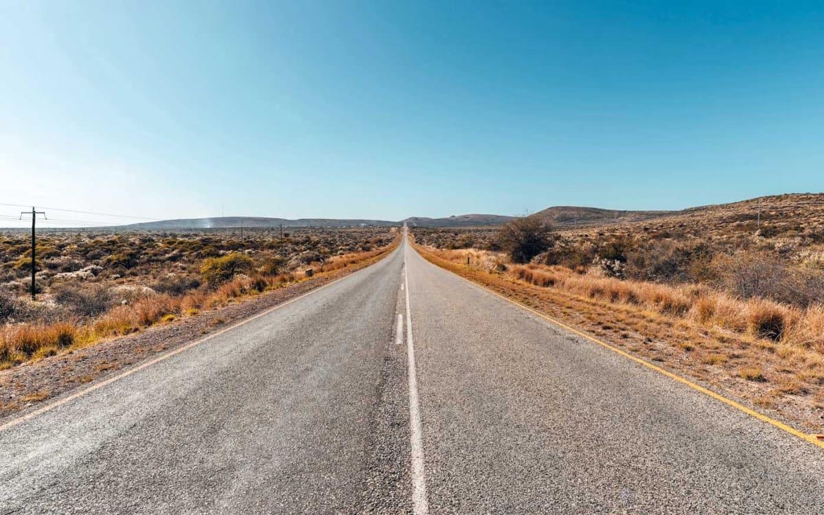 The endless straight road from Upington to the national park entrance, Twee Rivieren