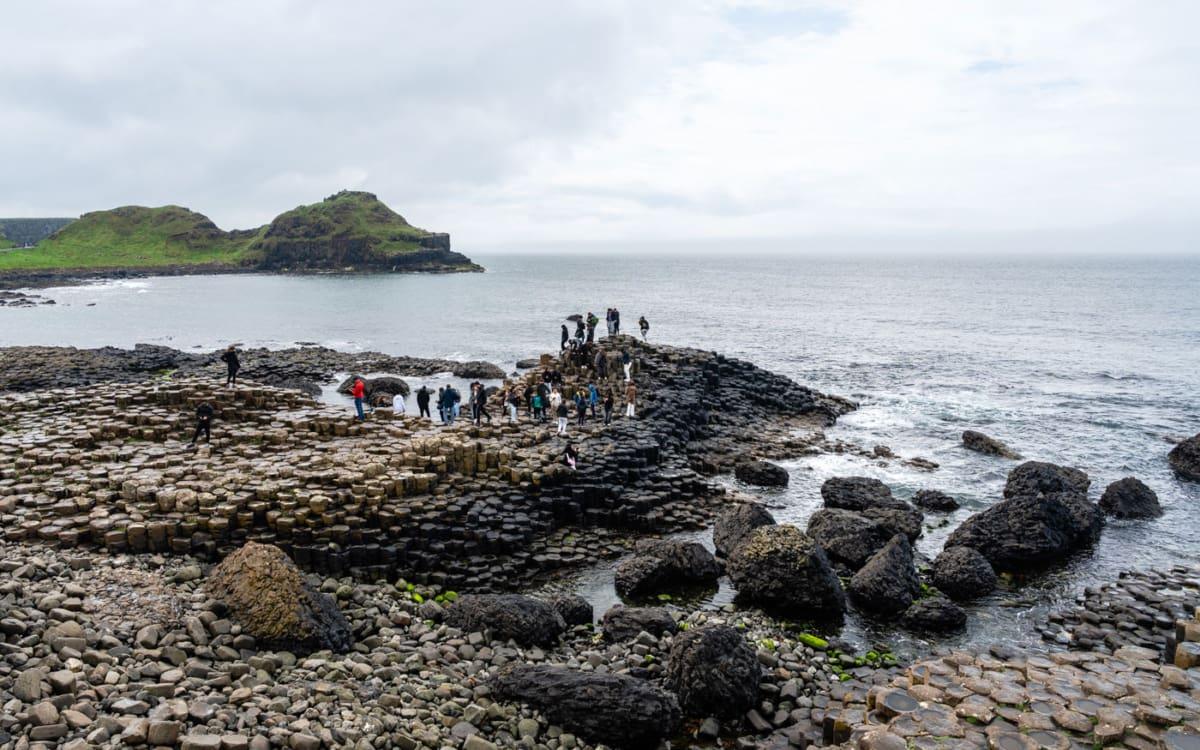 Giant's Causeway with many tourists all year round