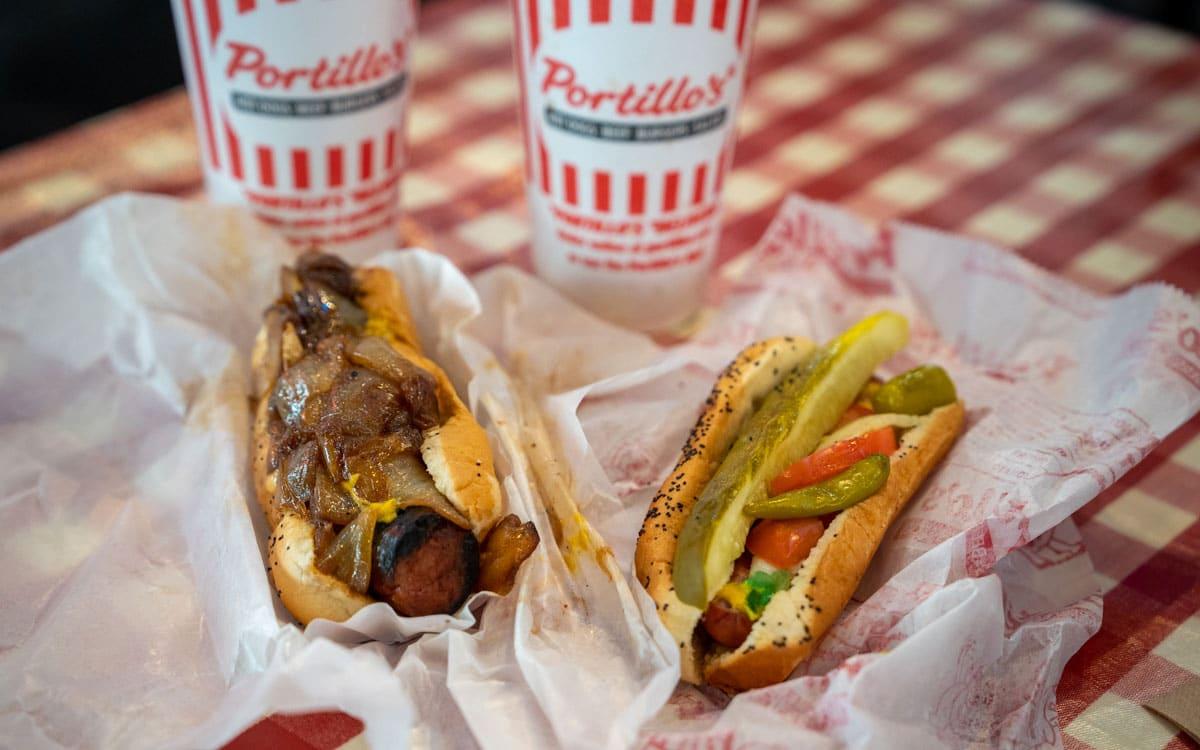 Left: Maxwell Street Polish Hot Dog and right the Chicago-style hot dog at Portillo's Hot Dogs
