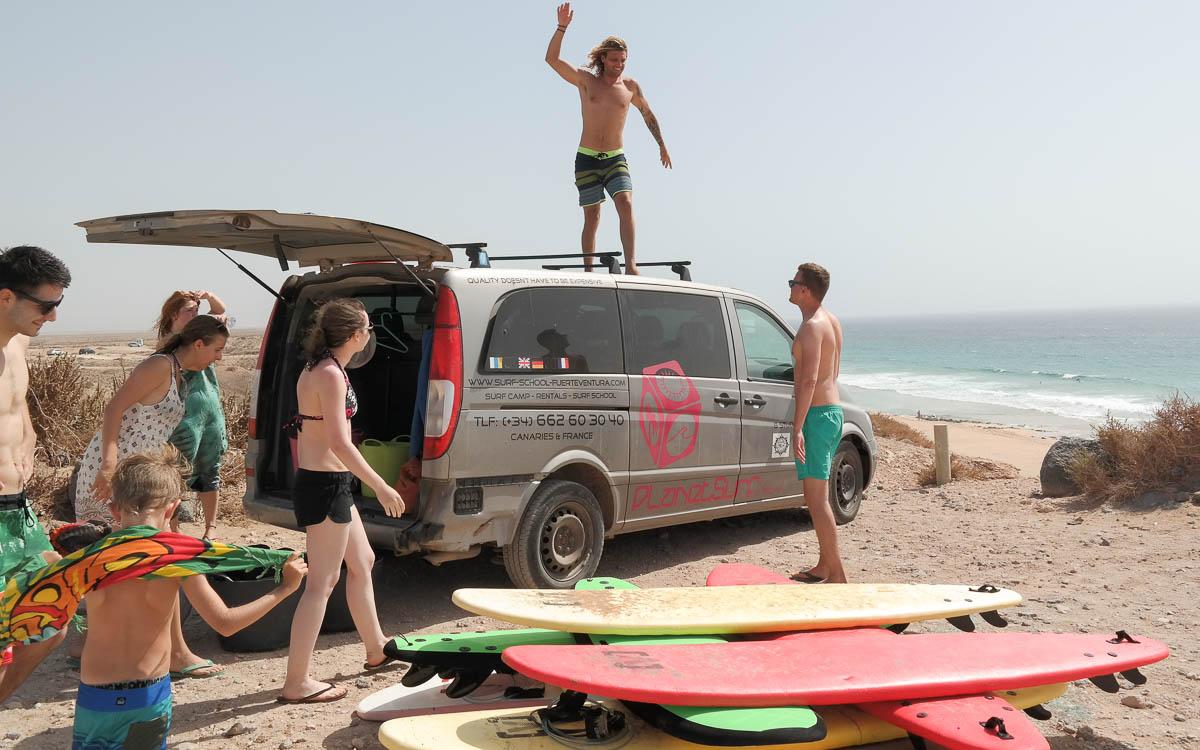 Surfing Fuerteventura Surf School Unloading Surfboard