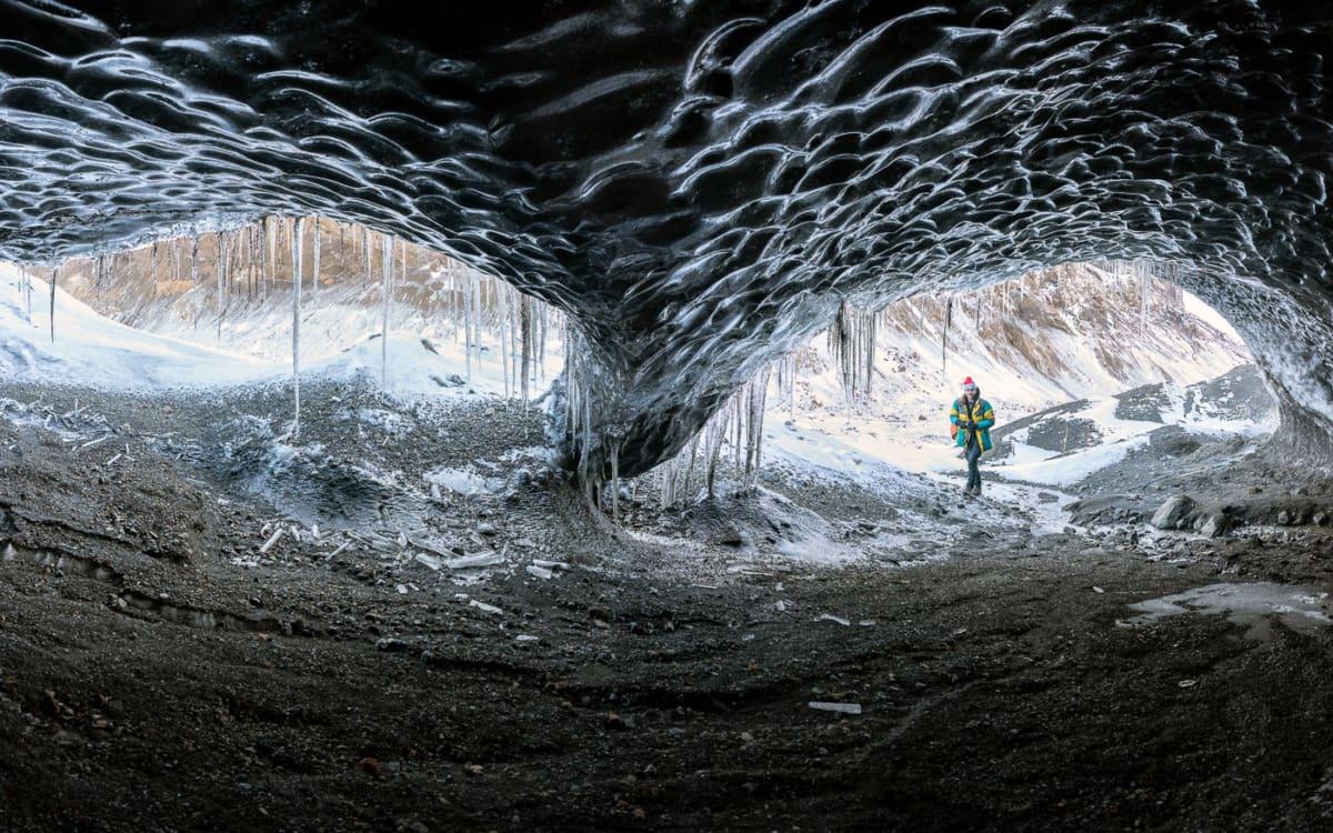 Secret black lava cave in the Icelandic highlands